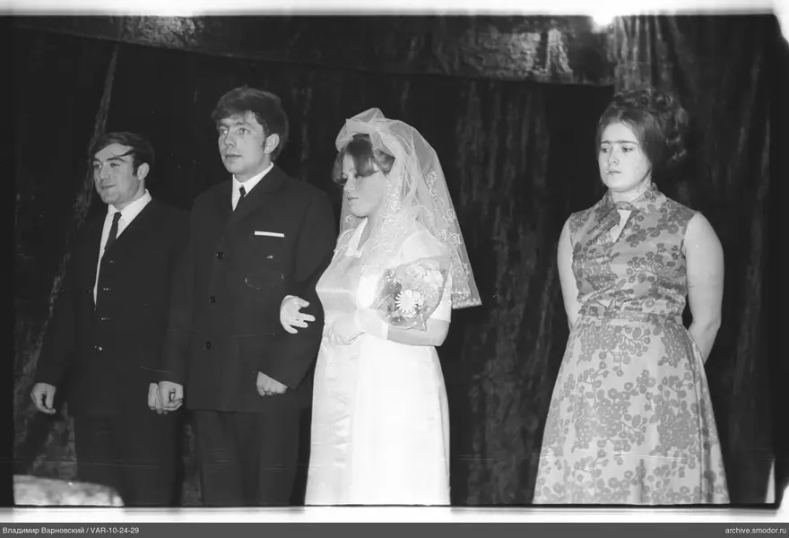 Group portrait with woman in white dress