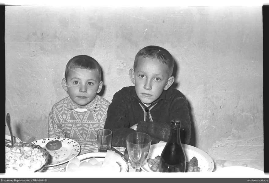 Two boys sitting at a table