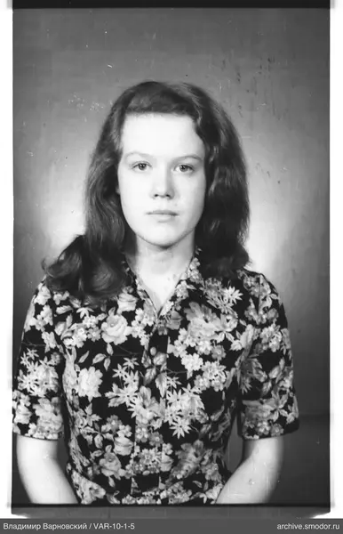 Portrait of a woman in a floral shirt