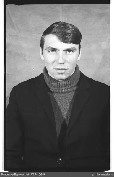 Portrait of a man in a sweater and jacket