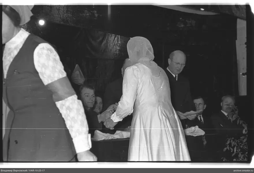 Woman with headscarf at the table