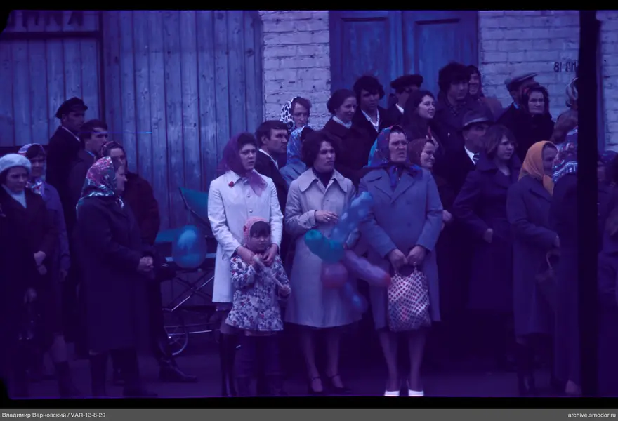 Group of people near gates and wall