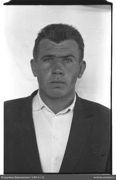 Portrait of a man in a light shirt and dark jacket