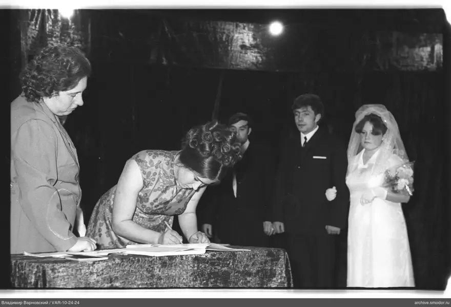Woman signing a document