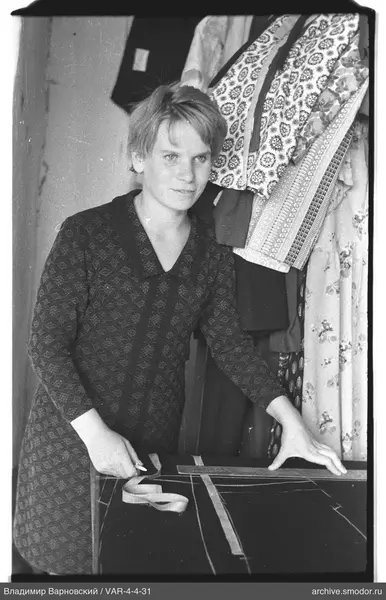 Woman with fabric and measuring tools