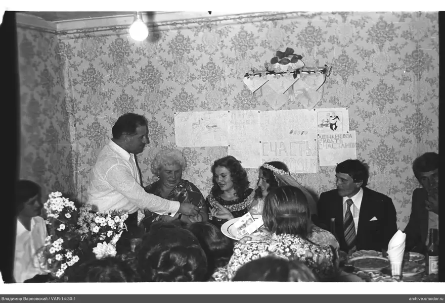 People sitting at a table during an event