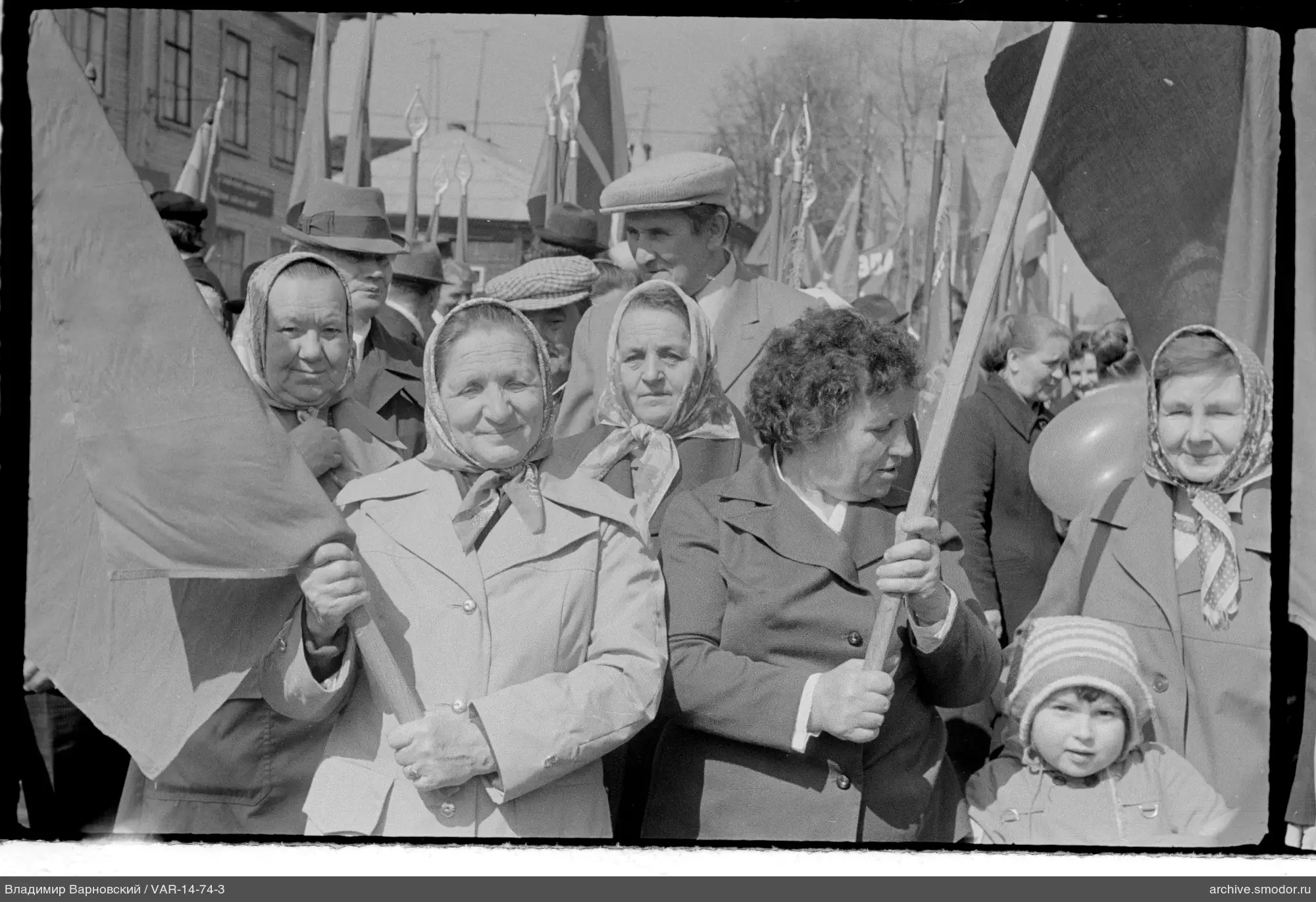 Group of women and child with flags