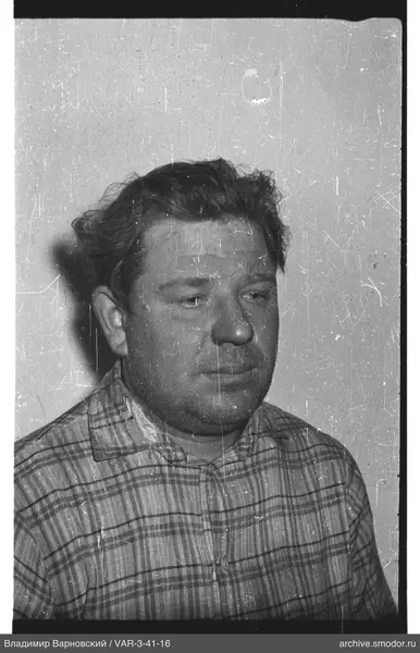 Portrait of a man in a checkered shirt