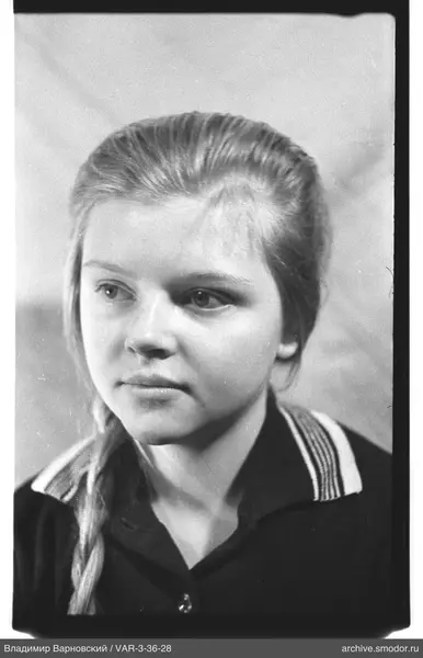 Portrait of a woman with braid and striped collar