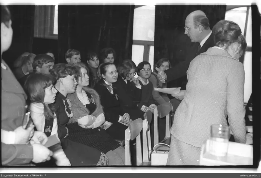 Man addressing a group at an event