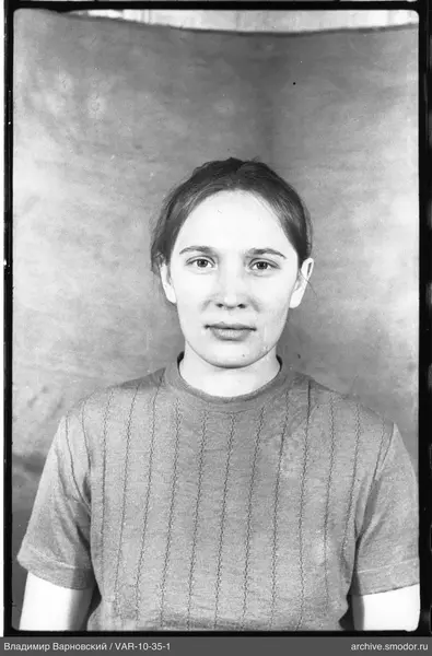 Portrait of a woman in a light jumper