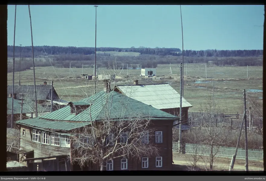 Wooden houses and open field