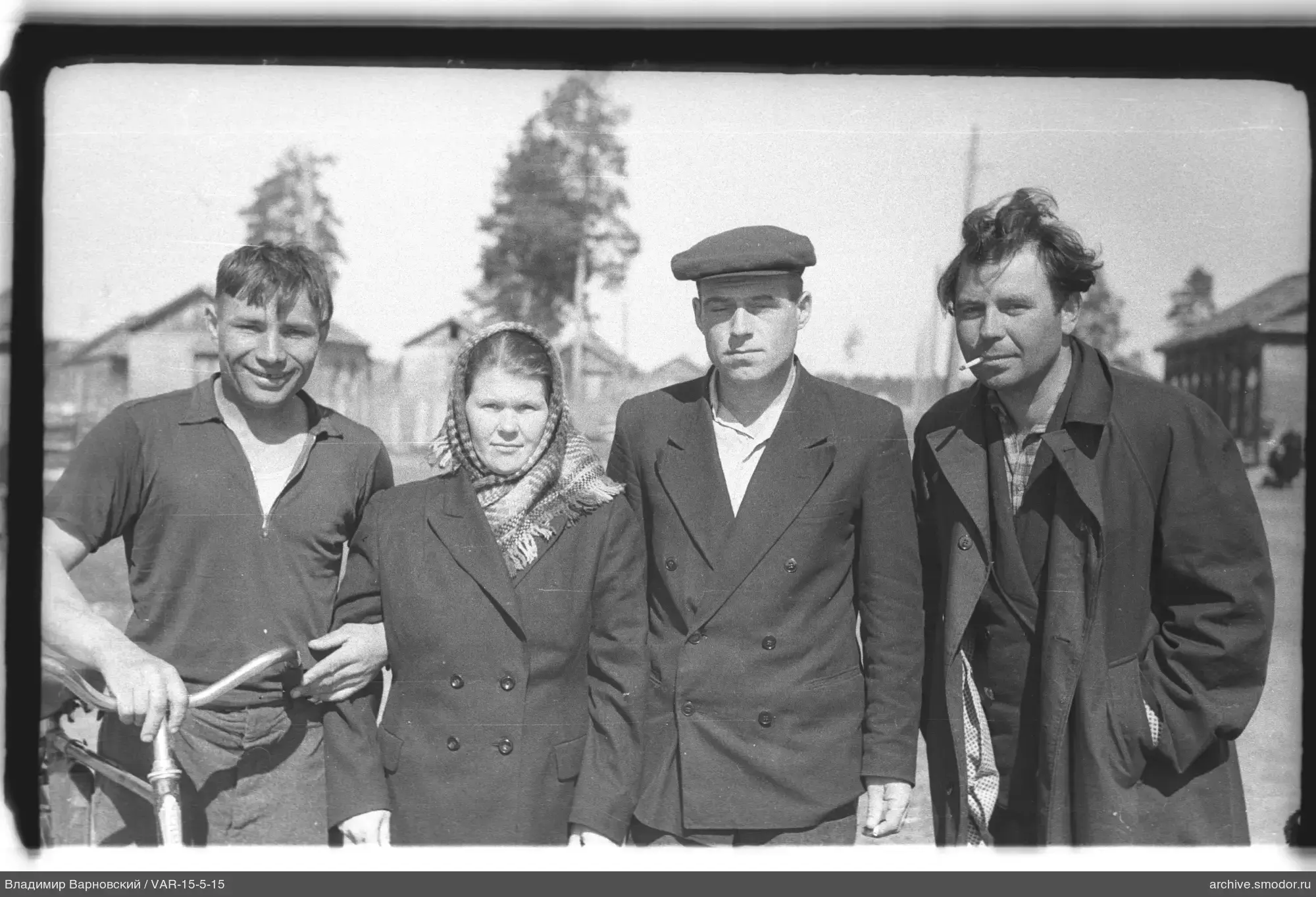 Group portrait with cyclist and woman