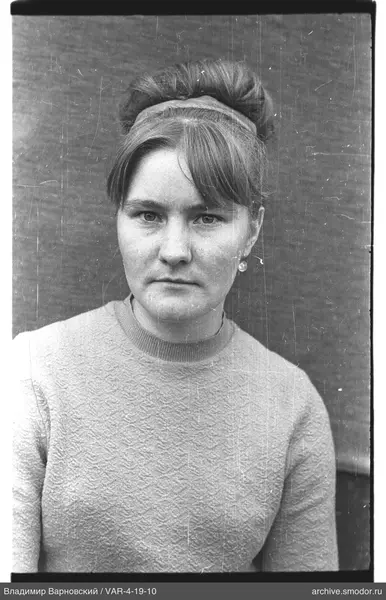 Portrait of a woman with a bun and earring