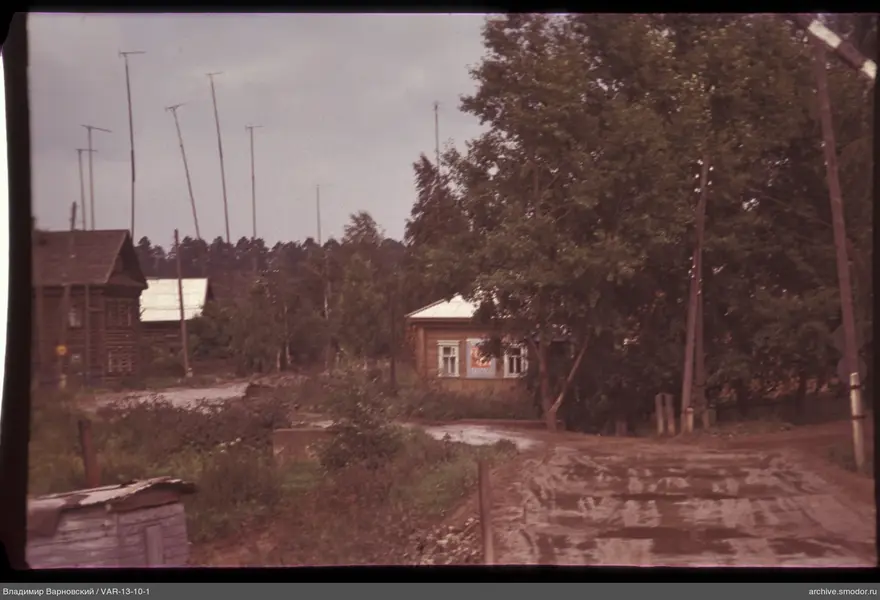 Wooden house with poster and road