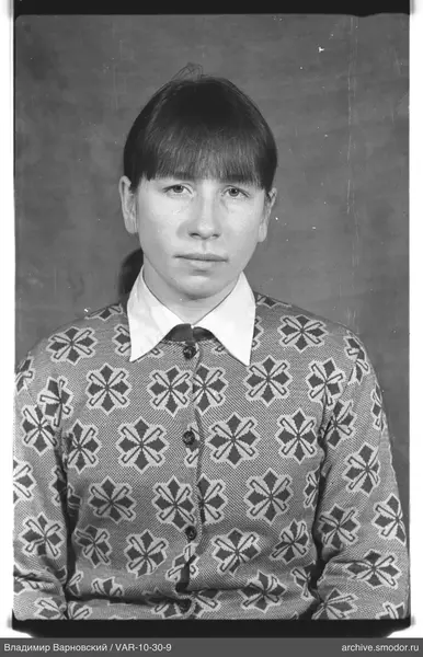 Portrait of a woman in a knitted cardigan