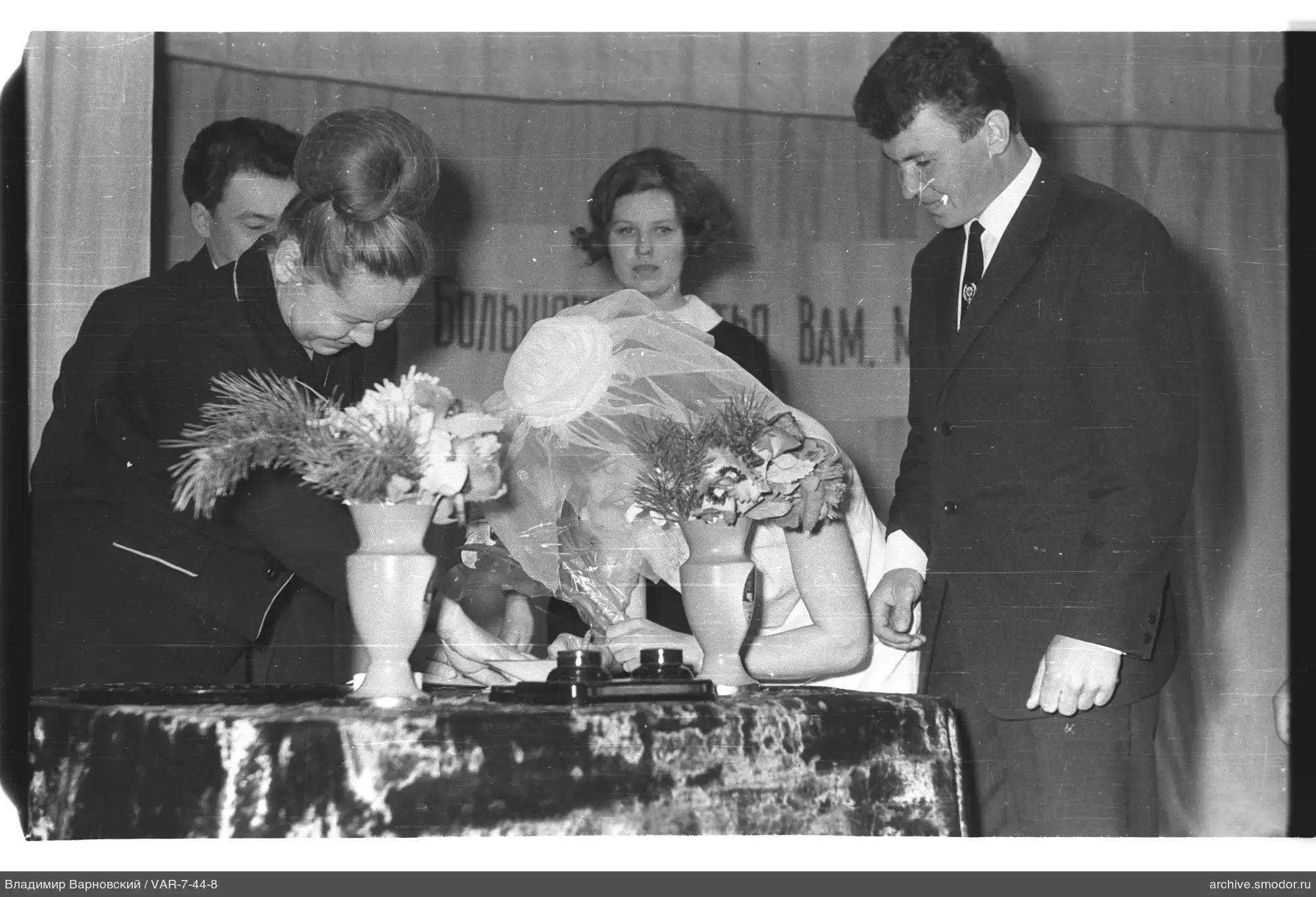 Bride signing a document at a table