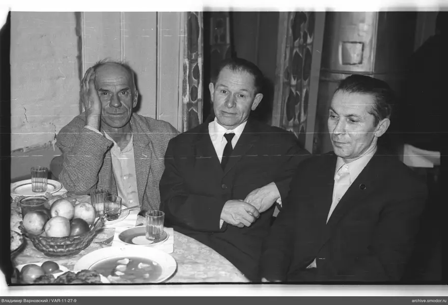 Group portrait of men at a table