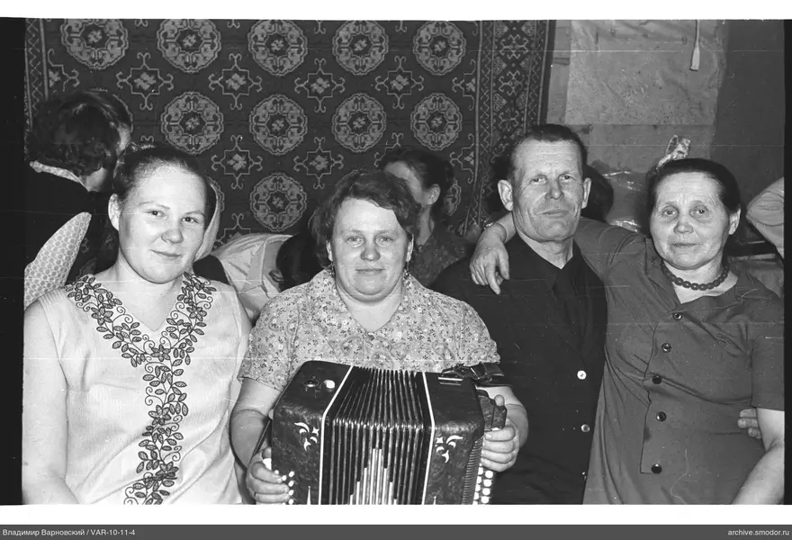 Group of people against patterned carpet