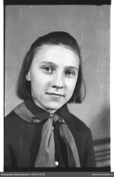 Girl's portrait in sweater and tie