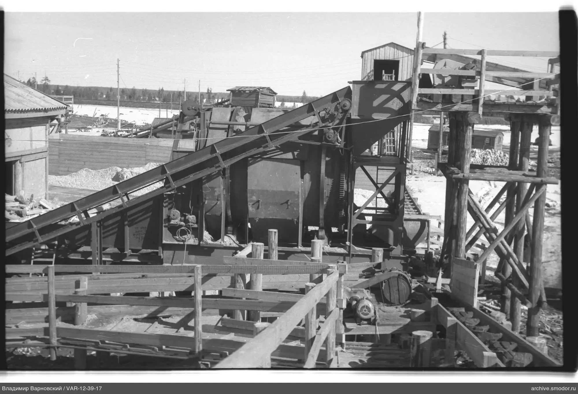 Industrial structure with conveyor and tower