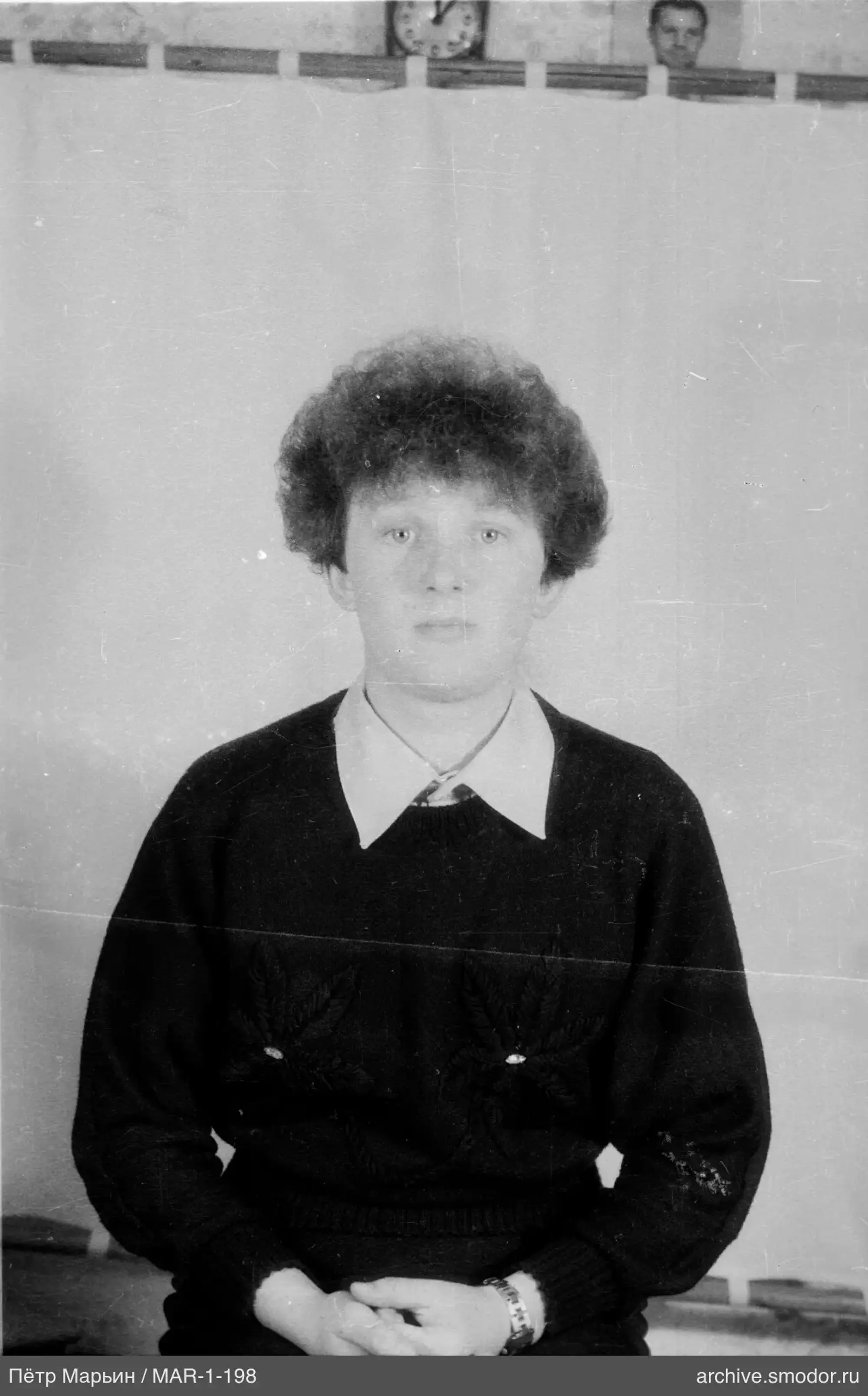 Portrait of a man in a patterned sweater