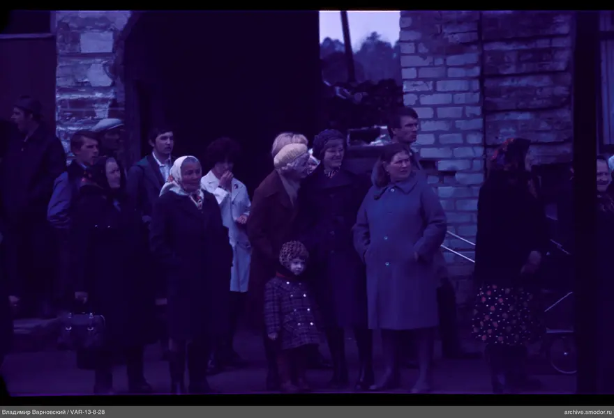 Group of people near a brick building