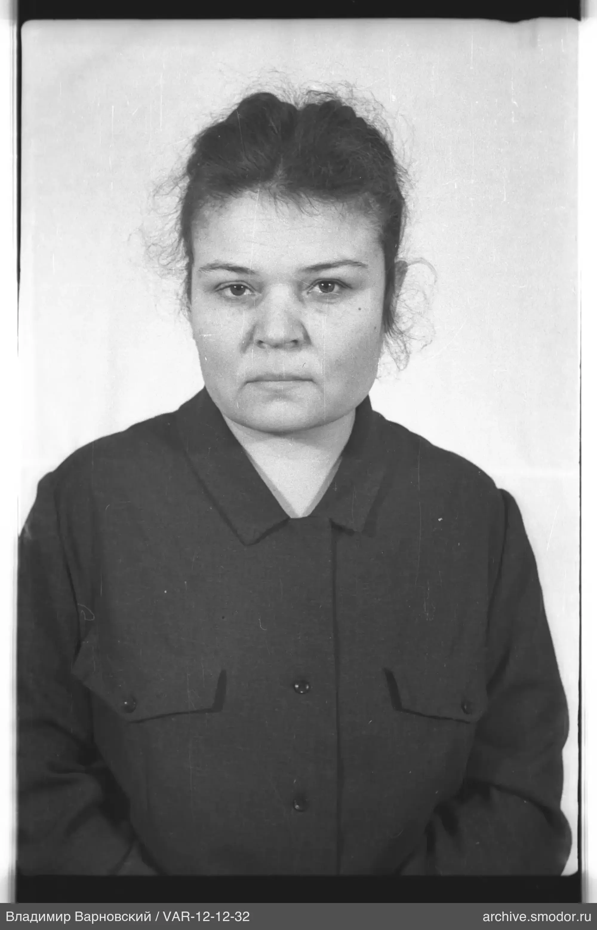Portrait of a woman against a light background
