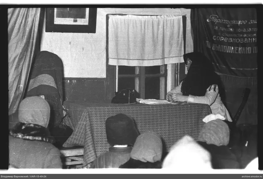 Woman sitting at a table during an event