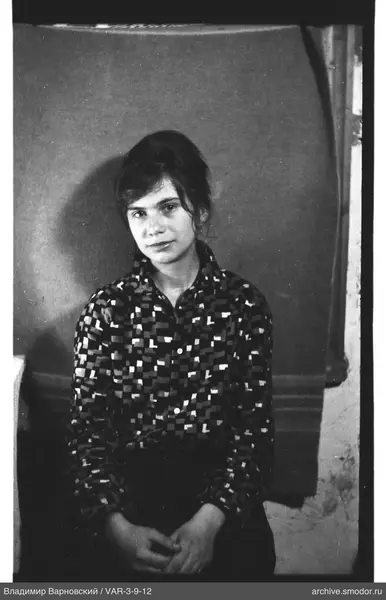 Portrait of a woman in a geometric shirt