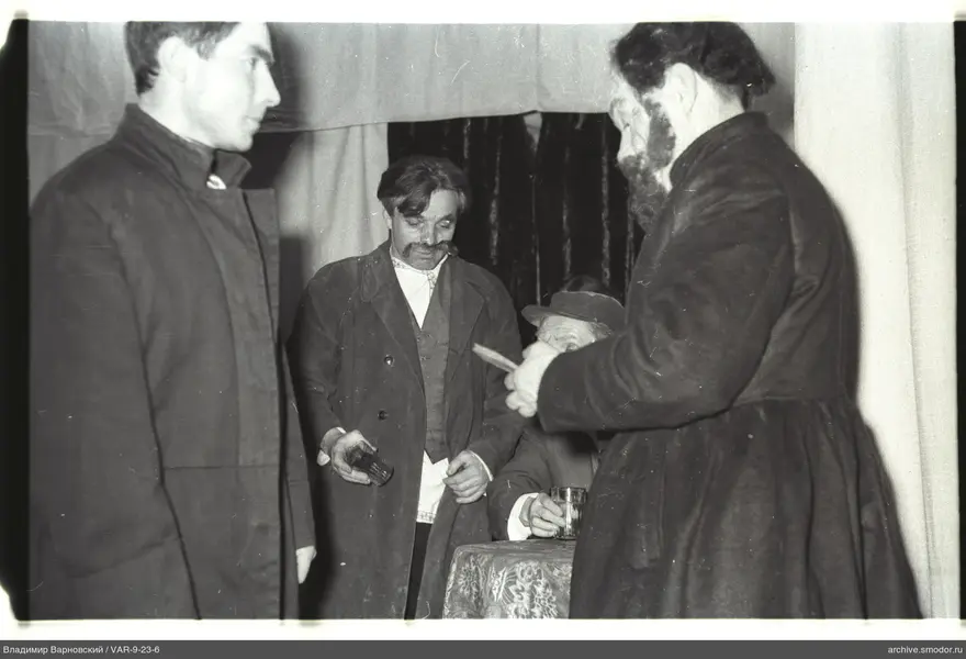 Men at a table during an event