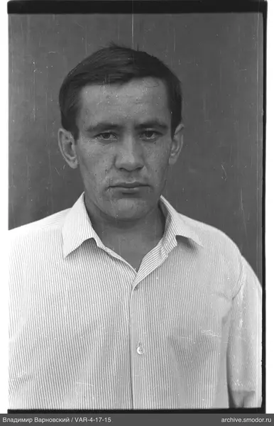 Portrait of a man with short dark hair