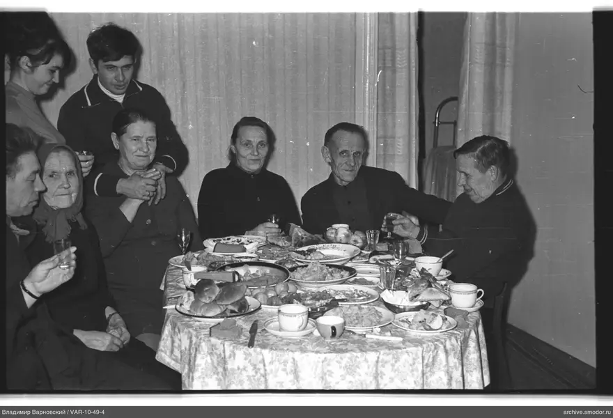 Group of people around a table with food