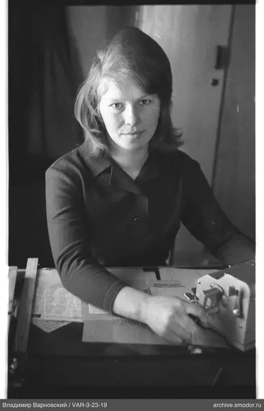 Portrait of a woman at a table