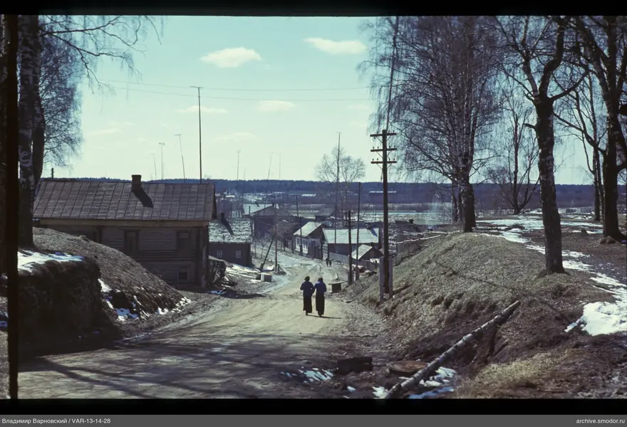Village street with two people and houses