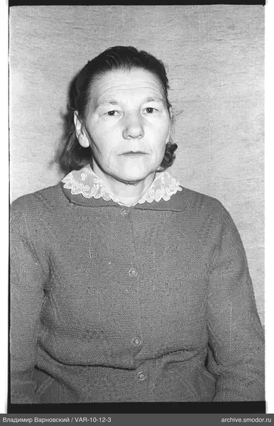 Portrait of a woman in a dark cardigan