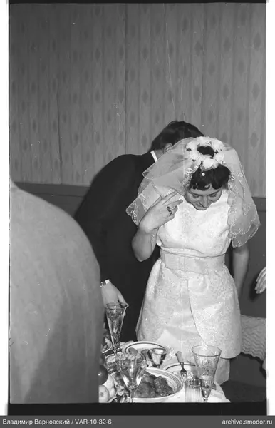 Woman in a dress with veil and man in suit