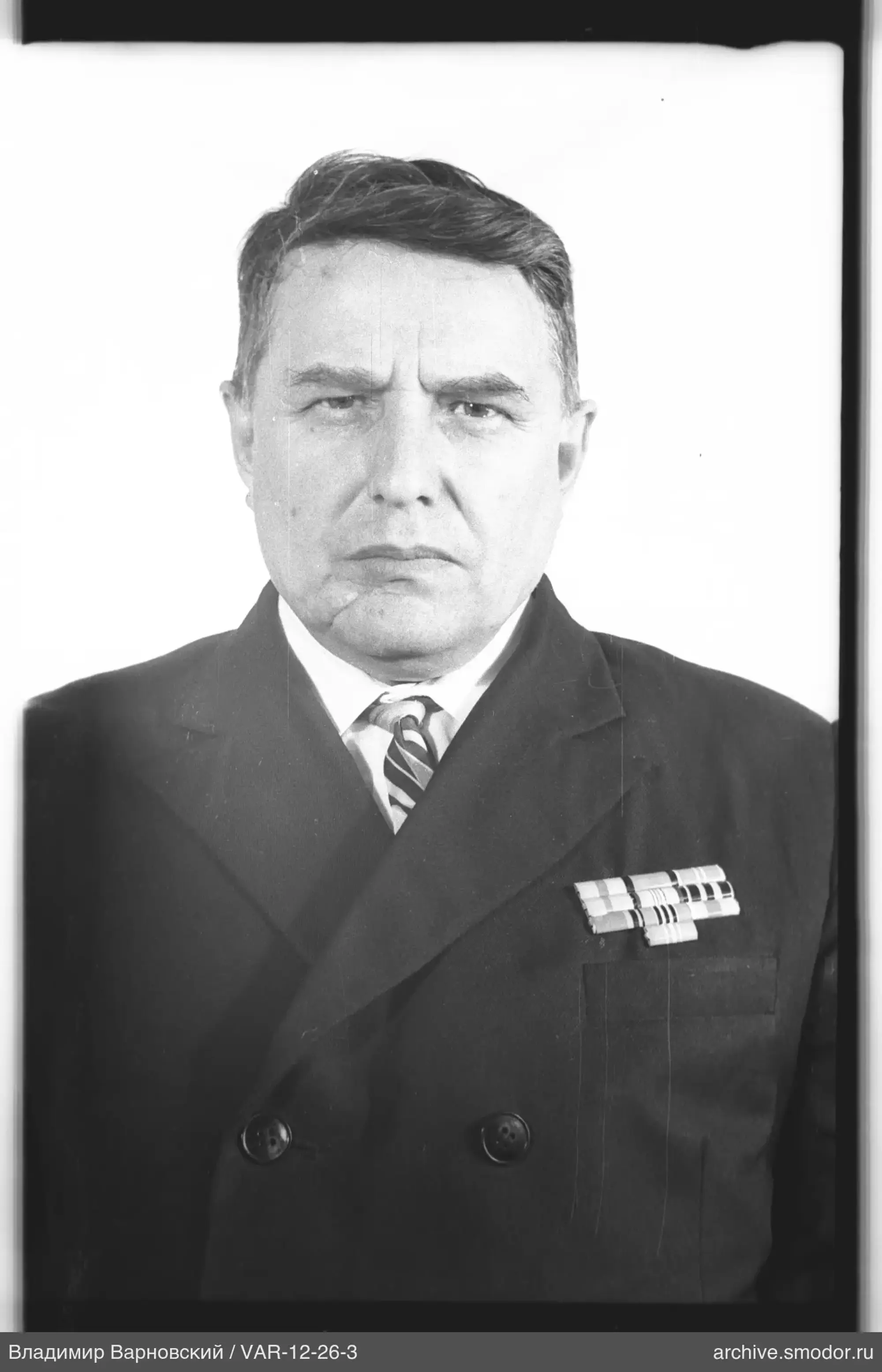Portrait of a man with ribbons in jacket
