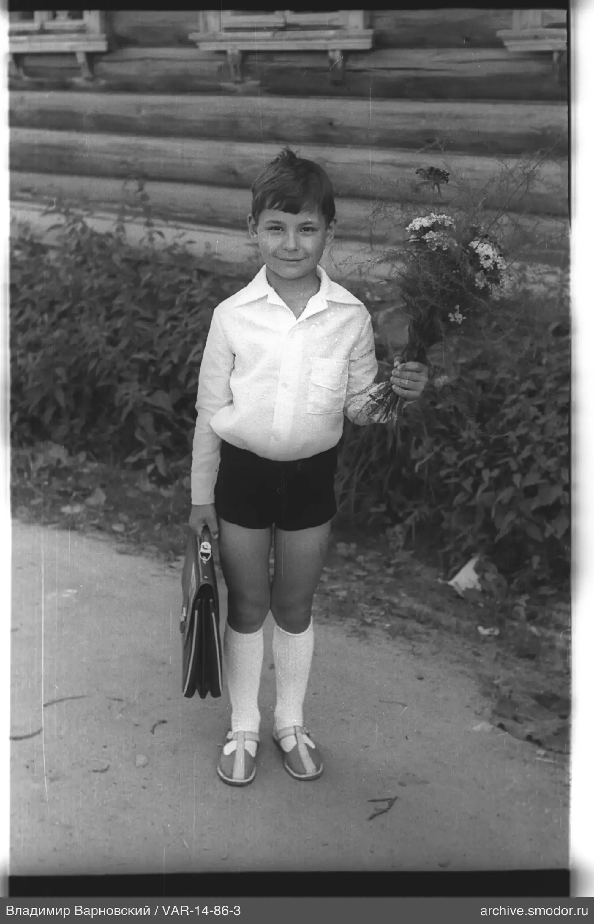 Boy with bouquet and briefcase