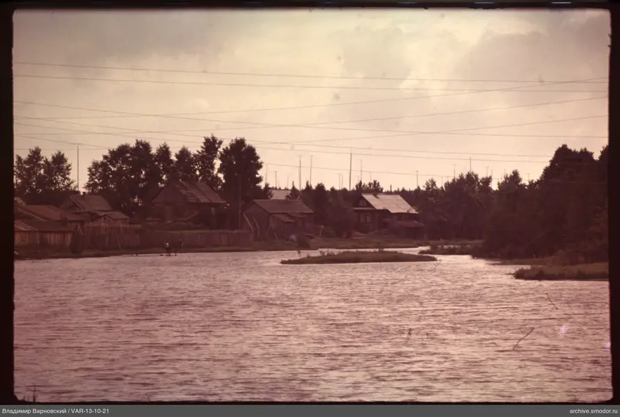 Person on a raft by the river with island