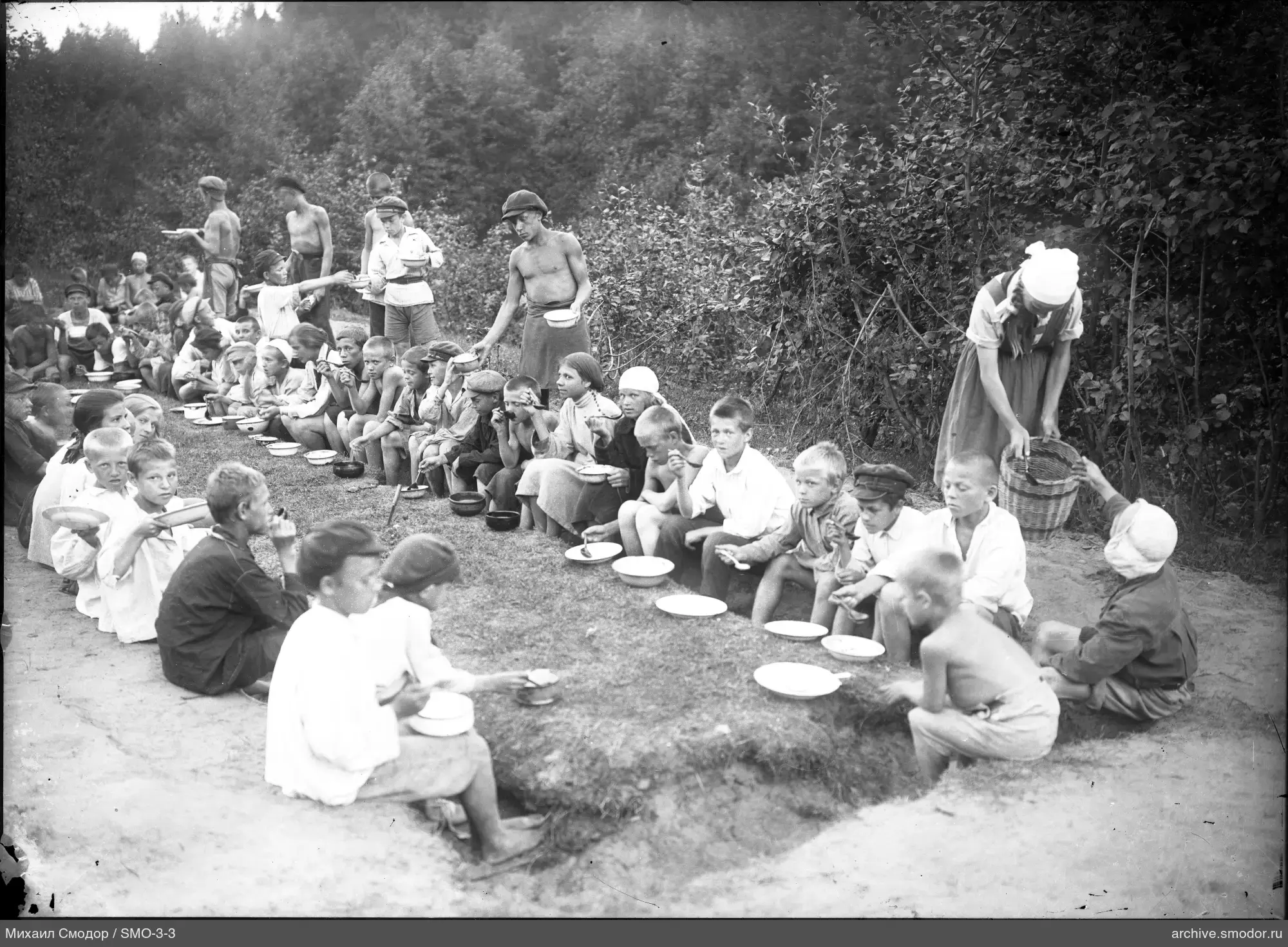 Children and teenagers with food outdoors