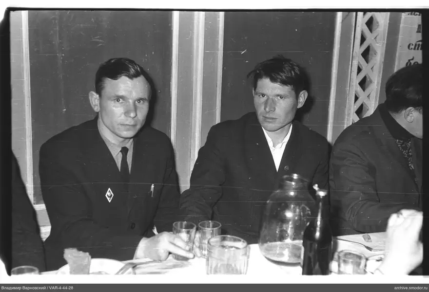 Group portrait of men at a table