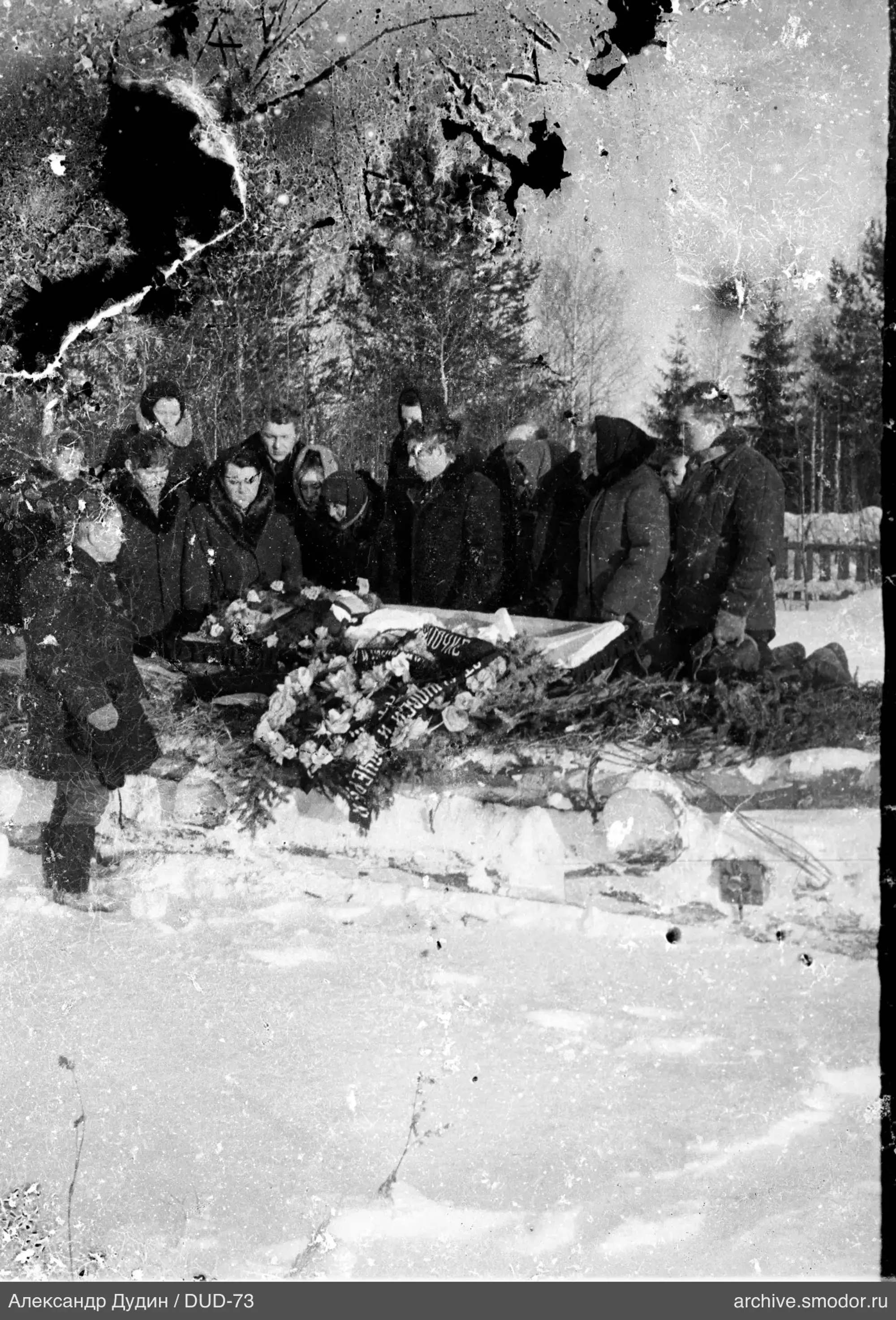 Group around decorated platform in snow