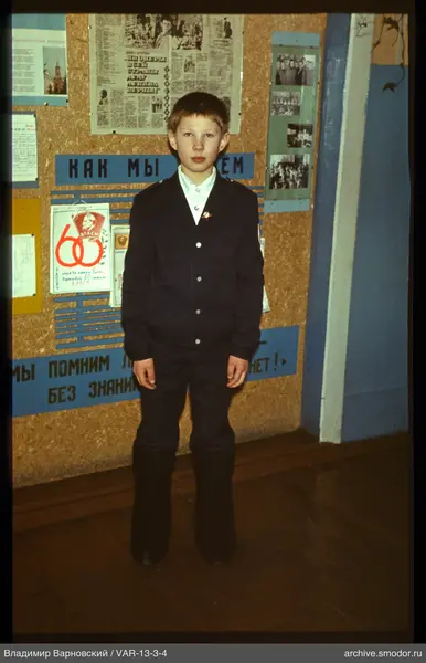 Boy in suit and valenki