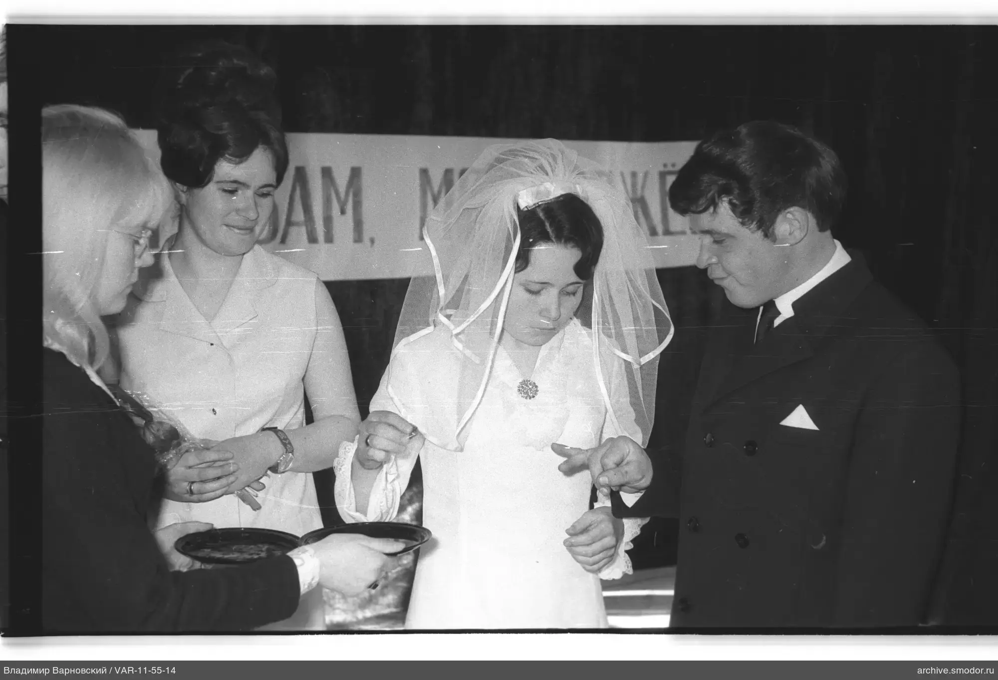 Bride and groom with guests at event