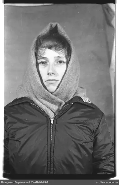 Portrait of a woman with a knitted headscarf