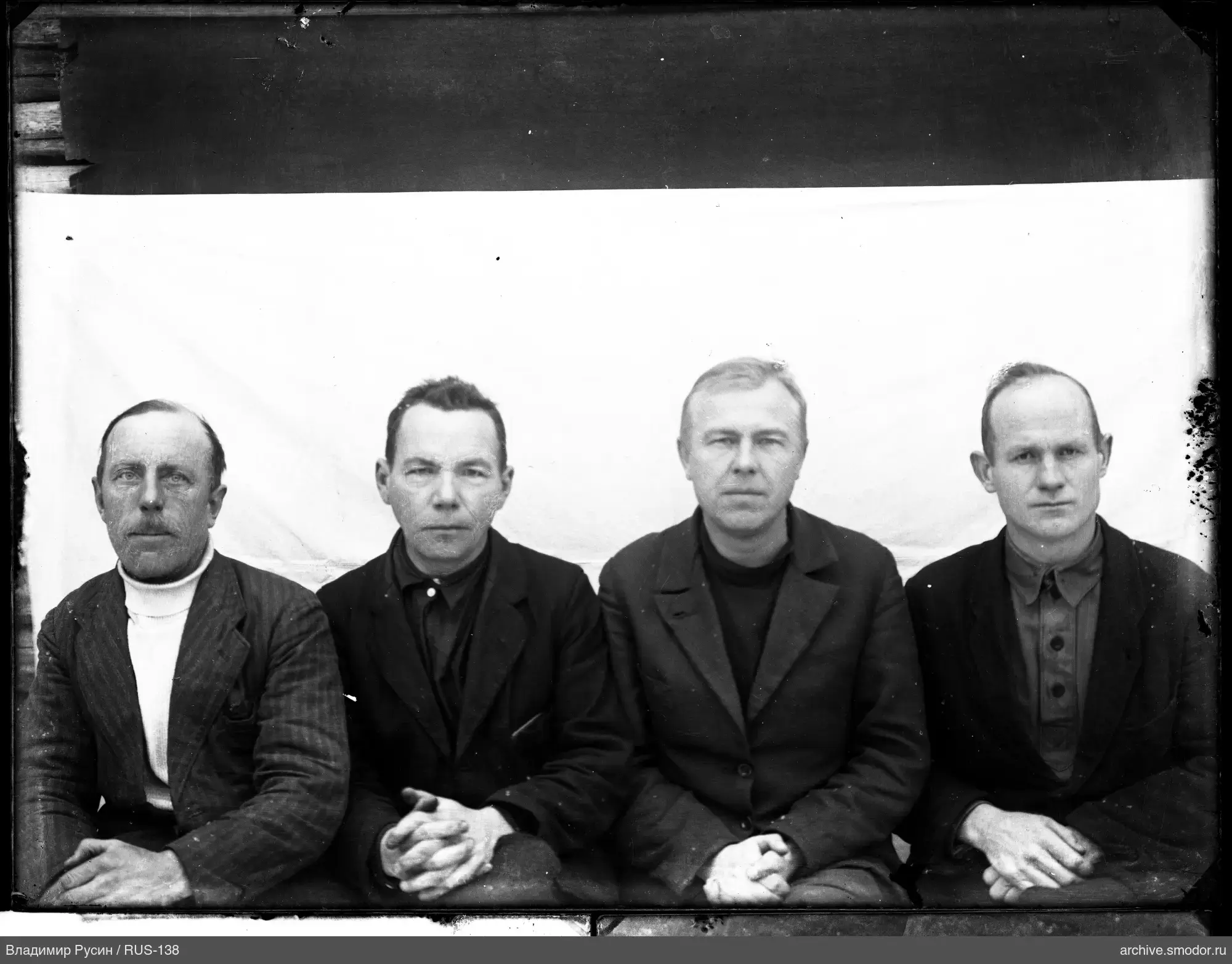 Group portrait of four men