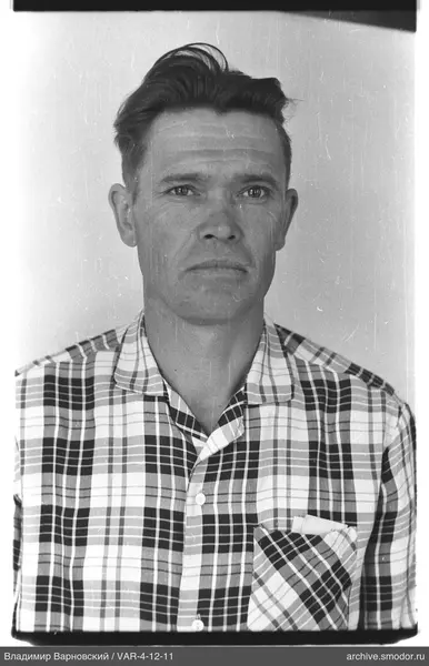 Portrait of a man in a checkered shirt