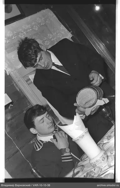 Two young men sitting at a table
