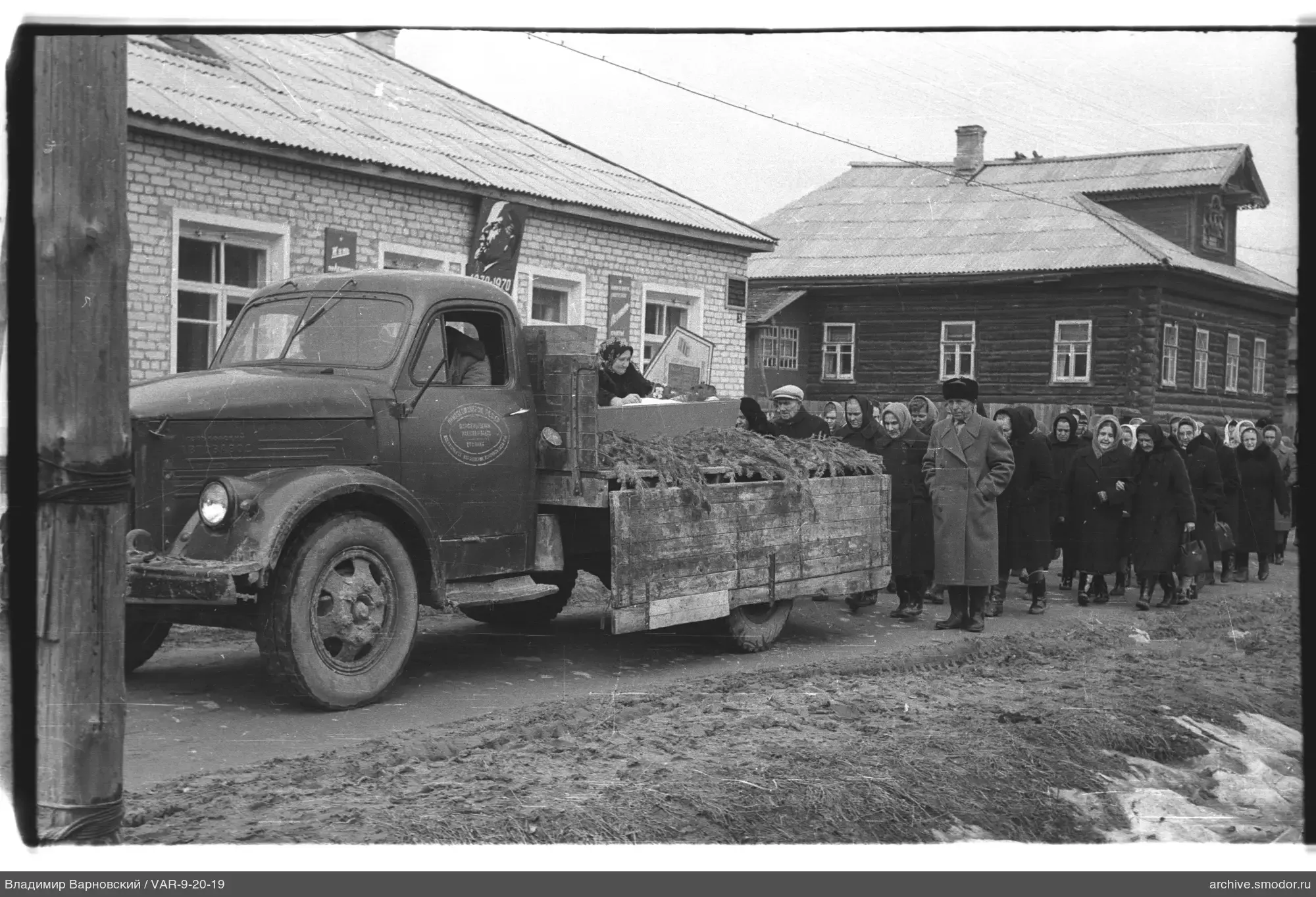 Group of women and cargo truck